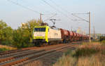 152 197 der Captrain schleppte am Morgen des 28.08.19 einen Schotterzug durch Greppin Richtung Bitterfeld.