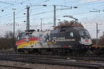 DB Lok 182 560-3 mit der Werbung für 25 Jahre Wiedervereinigung, durchfährt den badischen Bahnhof. Die Aufnahme stammt vom 09.01.2019.