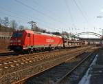 185 238-3 der DB Schenker Rail mit gemischtem Gterzug fhrt am 11.02.2012 durch Kreuztal Richtung Hagen.
