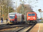 Ein Nachschuss von der 185 275-5 von Railion fhrt als Lokzug aus Aachen-West in Richtung Herzogenrath,Neuss. RB20 nach Aachen-Hbf hlt auf dem Nachbargleis in Kohlscheid bei Sonne am 29.3.2012.