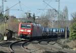 185 010-6 Doppeltraktion mit Stahlrollen auf Flachwagen durch Bonn-Beuel - 06.03.2013