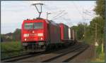 Die 185 279-7 ist mit einen Aufliegerzug (KLV) unterwegs nach Aachen. Hier zu sehen am BÜ in Rimburg auf der Kbs 485 am 11.Oktober.2014.