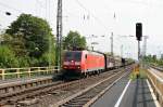 Durchfahrt am 25.04.2014 von 185 100-5 mit einem gemischten Güterzug in Müllheim (Baden) in Richtung Norden.