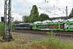 Seitenschuß auf die 185 574-1 die einen Hödlmayr Autozug in Rheydt Hbf gen Mönchengladbach Hbf.