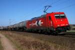 Alpha Trains Belgium 185 605, vermietet an HKG (2063), mit Kesselwagenzug in Richtung Sden (Vehrte, 27.03.11).
