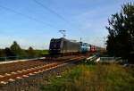 Mit der Niag Nr. 14 am Haken und deren Güterzug ist die MRCE 185 547-7 beí Allerheiligen in Richtung Neuss unterwegs. 3.10.2013