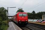 Mit einem leeren Zementzug fuhr am 09.07.2014 die RheinCargo 185 584-0 durch den Bahnhof von Orschweier.