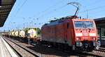 DB Cargo AG, Mainz mit ihrer  189 008-6  [NVR-Nummer: 91 80 6189 008-6 D-DB] und einem Containerzug mit ausschließlich Tankcontainern (Phosphor) beladen am 29.08.24 Höhe Bahnhof Schönefeld b Berlin.