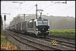 Vectron 193803 von Enercon, eine Railpool Lok, kam am 7.11.2017 um 11.34 Uhr mit einem langen Container Zug in Richtung Rheine fahrend durch den Bahnhof Lotte.