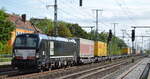 TXL mit der MRCE Vectron  X4 E - 610  [NVR-Nummer: 91 80 6193 610-3 D-DISPO] und Taschenwagenzug Richtung Rostock am 22.01.21 Durchfahrt Bf.