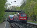 Ein Talent der Euregiobahn RB20 nach Langerwehe und RE9 geschoben von 111 010 nach Aachen Hbf begegnen sich am 16.04.2011 in Eilendorf.