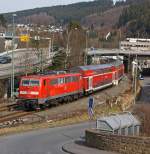 111 093 schiebt dem RE 9 (Rhein-Sieg-Express), am 17.03.2012 von Betzdorf/Sieg weiter in Richtung Siegen.