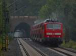 Am 31.08.2012 fhrt der Rhein-Sieg-Express als Sandwich gezogen von 111 077-4 und geschoben von 111 010 auf der KBS 480 bei Eilendorf durch den strmenden Regen.