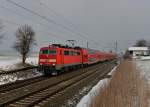 111 200 mit einem RE nach Salzburg am 01.04.2013 bei Hilperting.