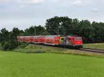 Die 111 024 mit dem BR Radlzug nach Piding am 04.08.2012 unterwegs bei Hilperting.