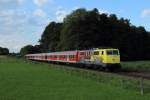111 024-6 mit einer Regionalbahn nach Rosenheim in Grokarolinenfeld am 17.07.2012. Auch hier war die Sonne mal wieder nicht anwesend...