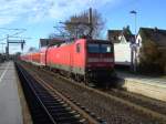 112 135-9 schiebt am 11.02.08 den RE 11 nach Dsseldorf aus dem Bahnhof Lippstadt. 