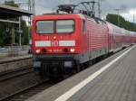 114 029 am 25.Juli 2009 bei der Einfahrt in Stralsund mit dem Regionalexpress aus Falkenberg/Elster.