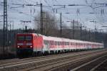 114 020 mit einen Schrottzug nach Hamm,am 26.02.2012 bei Wunstorf.