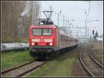 Der WarnemndeEspress aus Warnemnde nach Berlin gezogen von der 114 002 kurz vor dem Hp Rostock/Holbeinplatz am Sonntag den 08.04.07    