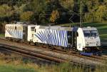 Die 185 661-5 mit 139 310-7 stehen als Lokzug von Nrnberg nach Mnchen kurz vor Donauwrth in der berholung am 02.10.2012