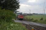 140 037-3 mit einem sehr lckenhaft beladenem Millionenzug, hier am 27.05.2011 zwischen Benhausen und Neuenbeken.