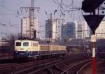 141 297 durchfhrt mit einem Eilzug Essen-West,    aufgenommen am 12.03.1991