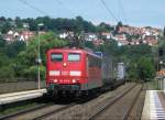 151 147 durchfhrt am 12.Juli 2011 mit einem Containerzug den Bahnhof Wernfeld Richtung Wrzburg. Im Hintergrund ist die Stadt  Wernfeld  zu sehen.