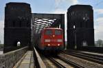 DB Schenker Rail 151 141 in Doppeltraktion mit einer weiteren 151er berqueren am 23.04.12 mit einem Schttgutwagenzug die Rheinbrcke Engers - Urmitz.