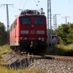 Ein traurigen anblick gab es heute am 21.07.2013 als 10x155er+151 091-6 von Rostock-Seehafen nach Opladen zum Bender gebracht wurden Zuglok war 185 296-1.Standpunkt Gterumfahrung Rostock Hbf  