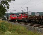 Begegnungen. 151 069-2 mit Schienen-Transport in Richtung Norden begegnet dem Tfzf 185 588-1 der HGK welche Richtung Süden fuhr. Aufgenommen am 10.07.2014 bei Karltadt.