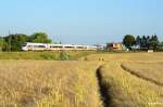 411 070 aus München, kurz vor seinem nächsten Halt in Rostock am 15.07.13 durch Gragetopshof.