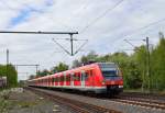 Ein S8/S5 Zug nach Dortmund ber Hagen, der vom 422 566-0 gefhrt wird, fhrt hier am Sonntag den 28.4.2013 in den Bahnhof Korschenbroich ein.