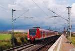 Ein S11 Zug verlsst gerade den Haltepunkt Allerheiligen bei Neuss. Er wird gefhrt vom 423 792-1 am 27.8.2011