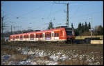 424529 mit Werbefläche hält hier auf der Fahrt nach Hannover HBF am 9.1.2003 im Bahnhof Dedensen-Gümmer.