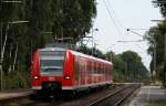 Endlich das Bild der Bilder. Ich hab unseren Bahnbilder User  mal in Echt erlegt: 425 320-9 als RE 14678 (Bremen Hbf-Nordenham) in Heidkrug 20.8.09
