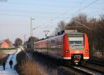 425 576 als RB11069 nach Aachen an der ehem. Anrufschranke in Geilenkirchen 19.12.09