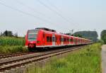 425 057-7 führt einen RE11 Umleiterzug in Korschenbroich An der Insel gen Mönchengladbach Hbf....den zwischen Viersen und Krefeld Hbf finden Bauarbeiten statt.