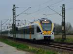 Dieser RE 13 Zug aus Venlo kommend ist nach Hamm Westfalen unterwegs, es sind die Eurobahntriebwagen ET 6.02 und der ET 7.02 die am 18.3.2014 bei Korschenbroich abgelichtet sind.