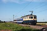 IRSI/IGE Re 4/4 11387 (Re 421 387-2) mit dem DPE 31396 (Basel SBB - Neustrelitz) am Morgen des 04.07.2020 zwischen Schliengen uun Auggen im Rheintal.