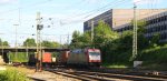 185 599-8 von Crossrail kommt aus Richtung Kln,Aachen-Hbf mit einem langen Ewals-Cargo-Care-Containerzug aus aus Novara(I) nach Genk-Zuid-Haven(B) und fhrt in Aachen-West ein in der Abendsonne am 14.6.2013.