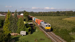 247 052-4 zieht den Südbahn-Containerzug am 07.09.2015 zwischen Langenargen und Kressbronn in Richtung deutsch-österreichische Grenze.