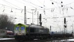 Die Class 66 6601 von Captrain fhrt mit einem Aluminiumleerzug aus Nievenheim bei Dormagen nach Kinkempois(B)Dunkerque(F) bei Ausfahrt aus Aachen-West und fhrt in Richtung Montzen/Belgien bei Sonne und Wolken Mix am 2.3.2013.