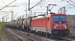 DB Cargo AG [D] mit  187 083  [NVR-Nummer: 91 80 6187 083-1 D-DB] und Kesselwagenzug am 12.11.19 Bf. Flughafen Berlin Schönefeld. 