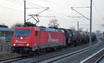 RheinCargo GmbH & Co. KG, Neuss [D] mit  185 582-4  [NVR-Nummer: 91 80 6185 582-4 D-RHC] und Kesselwagenzug am 23.02.21 Berlin-Johannisthal.