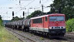Fahrzeugwerk Karsdorf GmbH & Co. KG, Karsdorf mit ihrer  155 119-1  (NVR:  91 80 6155 119-1 D-FWK ) und einem Kesselwagenzug am 18.07.24 Höhe Bahnhof Saarmund.