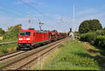 Soeben die Blockstelle Zscherben passiert, bringt 185 251-6 Schüttgutwagen Richtung Halle (Saale).