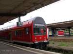 Einer der wenigen verkehrsroten Steuerwagen der Bauart DABbuzf777 am 11.07.01 im Bahnhof Dessau.