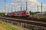 Am Sonntag den 7.8.2016 schiebt die 111 012 einen RE4 nach Dortmund Steuerwagen voraus gerade aus Herzogenrath aus.