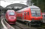 Einmal im Schnee, einmal bei schnem Wetter und nun einmal bei sch*** Wetter: Thalys nach Paris Nord und RE9 nach Gieen nebeneinander in Aachen Hbf 28.3.2009